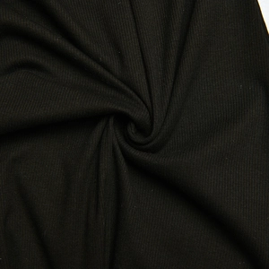 Detailed macro view of black ribbed knit fabric texture on the sleek sexy bodysuit