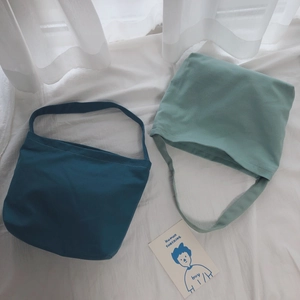 Minimalist cotton canvas shoulder bags in deep teal and pale bean green colors