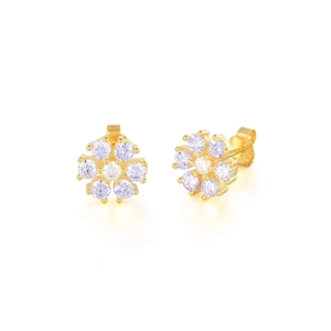 Macro detail of gold flower stud earrings with six-petal sparkling zircon stones