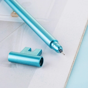 Creative teal metal gel pen with unique key-shaped cap design and 0.5mm tip