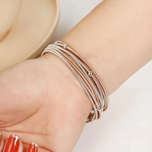 Classic 1.7mm multi-layer spring wire bracelet with polished beads in mixed metal colors