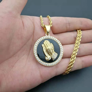 Iced out praying hands medallion pendant with gold plated twist chain and crystals