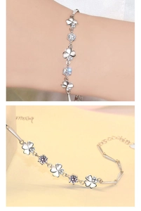 Close-up of S925 sterling silver four-leaf clover bracelet with zircon crystal detailing