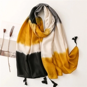 Long yellow gradient scarf with fringe tassels and soft textured fabric for autumn