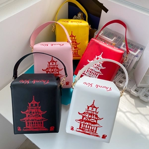 Macro view of Chinese takeout box style PU handbags with Thank You print and tower pattern
