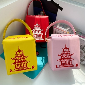 Three creative takeout box shaped crossbody bags in pink, yellow and red with pagoda print