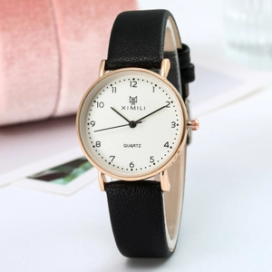 Minimalist women's quartz watch with black leather strap and rose gold round metal case
