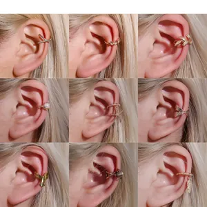 Set of minimalist gold leaf and star ear cuffs shown on model in a grid layout