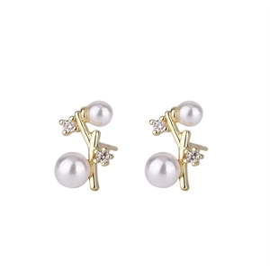 Elegant gold twig stud earrings with white pearls and sparkling cubic zirconia accents