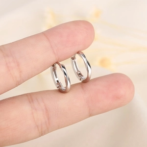 Elegant Mobius twist circle hoop earrings in polished silver finish for women