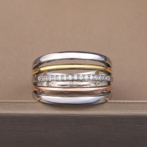 Detail of three-tone layered band ring featuring sparkling cubic zirconia pavé setting