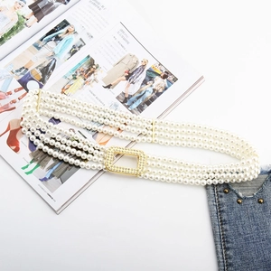 Detail of four-row pearl elastic belt with sparkling rhinestone gold buckle for dresses