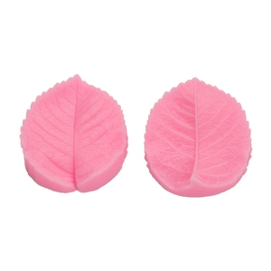Two-piece pink silicone leaf mold with realistic vein textures for fondant cake decorating