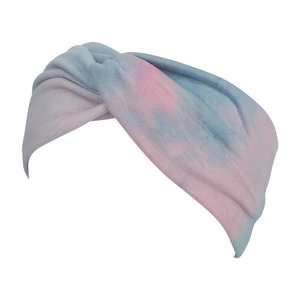 Detail view of pink and blue tie-dye wide twist headband with elastic fabric texture