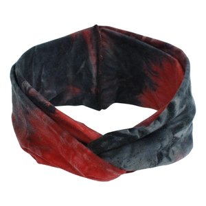 Detail of red and black tie-dye twist headband with soft elastic knit fabric texture