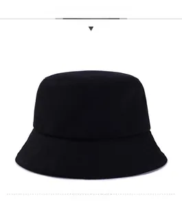 Detailed close-up of stitching and cotton canvas texture on a black minimalist bucket hat