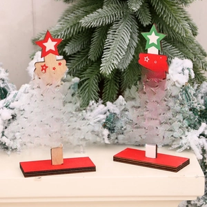 DIY wooden mini Christmas tree table decorations with festive lettering and star toppers
