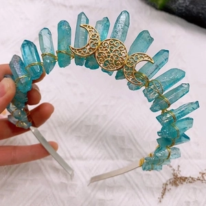 Detailed close-up of teal natural crystal crown with gold triple moon goddess symbol