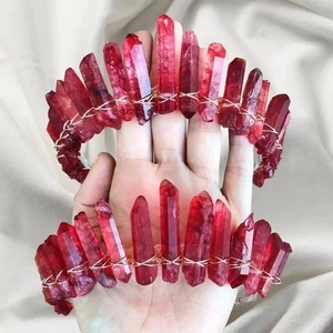 Close-up of handmade bridal crown set with red raw crystal stones and wire wrapping