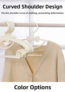 Detail of cream adjustable baby hanger with arc shoulder design and bow decoration