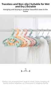 Detail view of colorful non-slip adjustable hangers with decorative bow and storage hooks