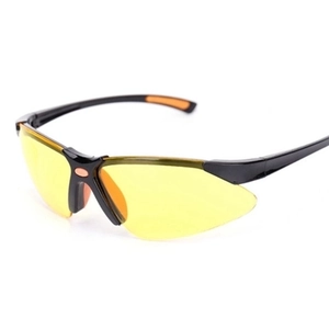 Detail of square sports sunglasses with yellow lenses and black frames with orange accents