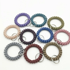 Set of 10 colorful matte spiral telephone wire keychains with metal rings in various colors