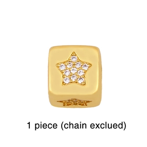 Detailed macro view of 18K gold plated cube charm with star pattern and zircon inlay