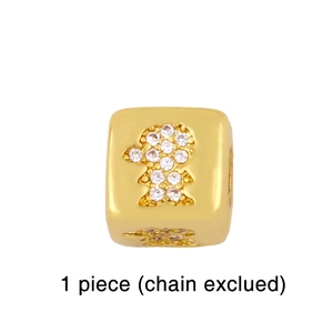 Detailed macro view of a gold-plated cube bead with a girl silhouette and zircon inlay