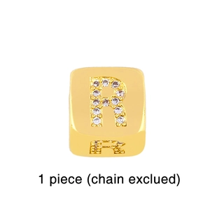 Detailed close-up of a square gold plated charm featuring a micro-pave zircon letter R