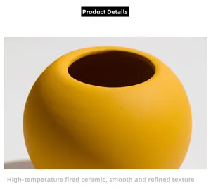 Close-up of matte ginger yellow ceramic vase with detailed spherical texture and glaze
