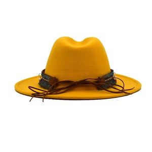 Classic mustard yellow wool felt fedora hat with ethnic braided band and tassel detail