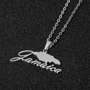 Detailed view of silver stainless steel Jamaica map pendant with cursive engraving