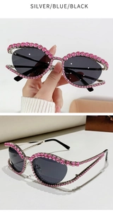 Dettaglio di occhiali da sole cat-eye argento con strass rosa e lenti grigio scuro