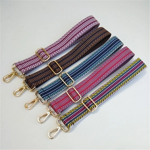 Adjustable colorful embroidered bag straps with gold buckles and patterned woven design