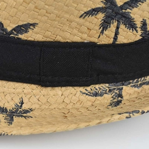 Classic straw sun hat with black palm tree pattern and wide decorative ribbon