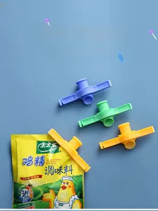 Three-piece food sealing clips with pouring spouts in blue, green, and yellow