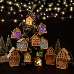 Lighted wooden Christmas house ornament with laser-cut Santa and reindeer designs