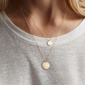 Double-layered gold stainless steel necklace with round matte disc pendants on O-chain