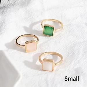 Three square natural stone rings in green, pink and white with gold finish small size