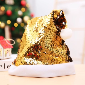 Christmas hat with gold reversible sequins and reindeer antlers on a festive background