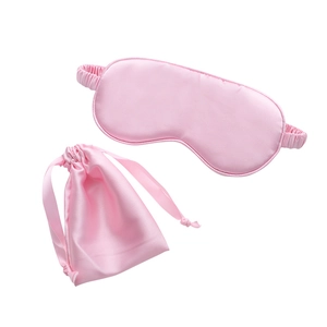 Pink silk sleep mask set including a drawstring storage bag on a clean white background