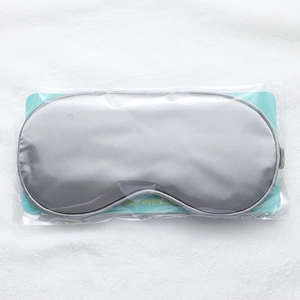 Grey faux silk sleep eye mask set in transparent packaging with blue card insert