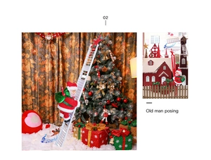 Detail view of electric climbing Santa Claus toy on white ladder with festive green gift bag