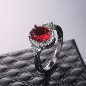 Classic silver S925 ring with oval red gemstone and halo micro-set zircon accents