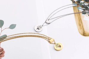 Close-up of double layer heart pendant necklace in gold and silver stainless steel