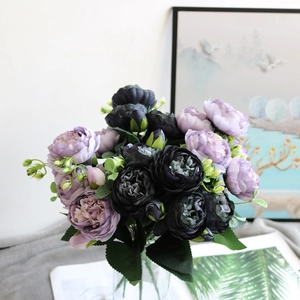 Detailed view of artificial peony bouquet featuring vintage black and purple silk petals