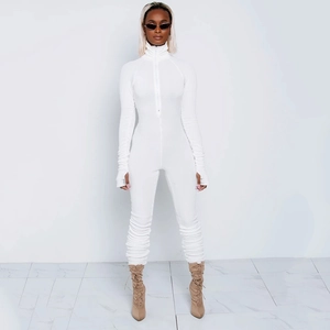 Detailed view of white long sleeve bodysuit featuring a front zipper and ruched fabric details