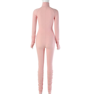 Detailed back view of pink ribbed knit long sleeve bodysuit showing bodycon fit