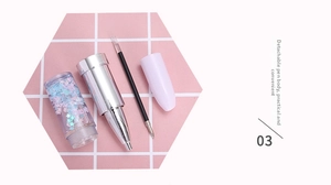 Disassembled lipstick-shaped gel pen with pink and blue glitter stars and silver tip